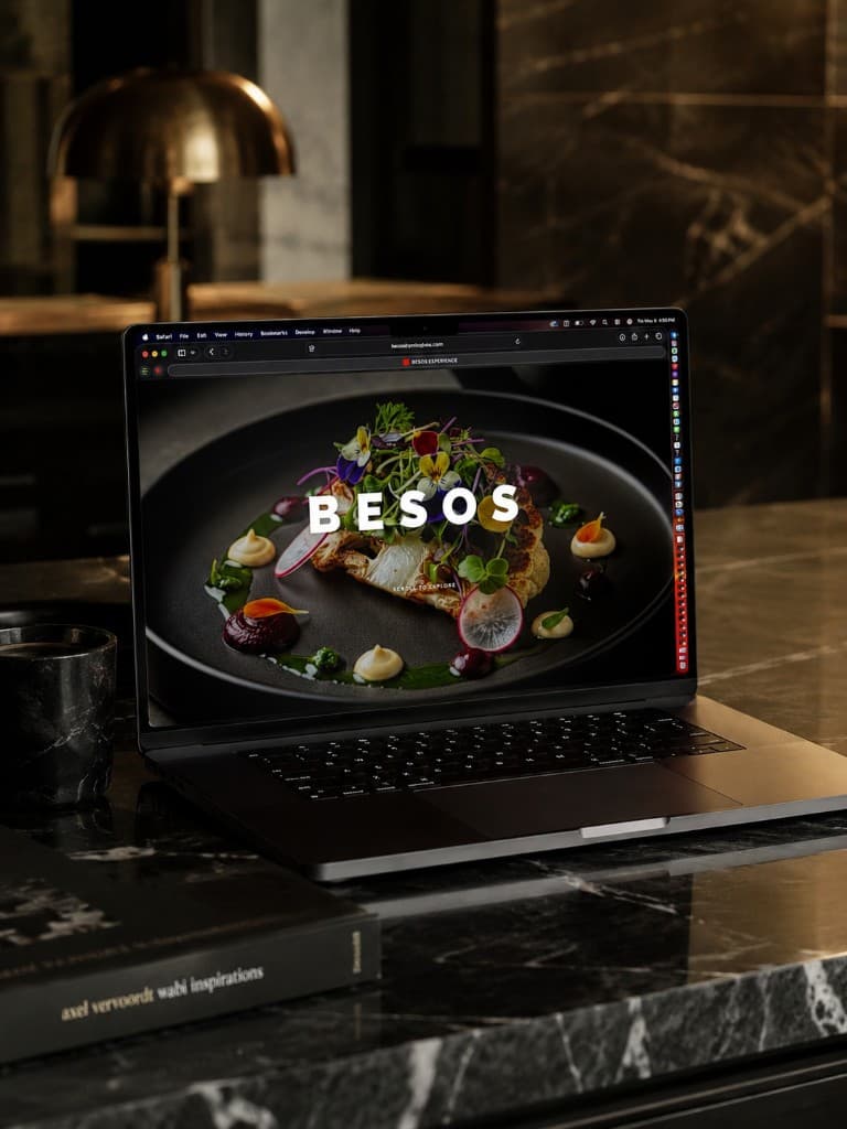 BESOS website displayed on a MacBook Pro