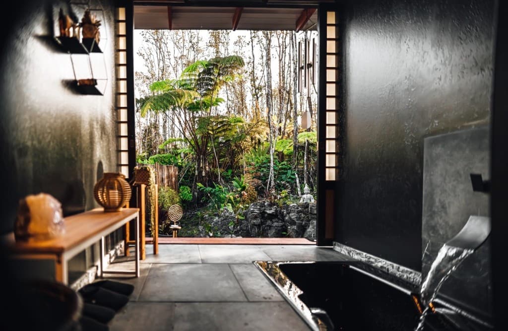 Indoor-outdoor bath opening to a zen garden
