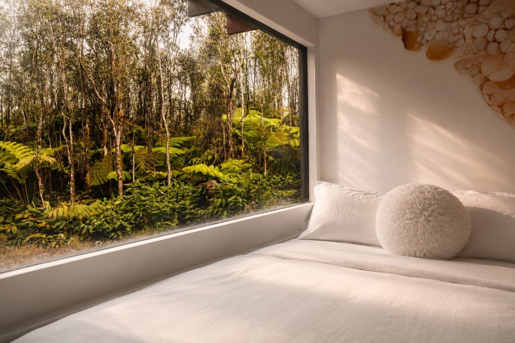 Bedroom nook with mural and round pillow