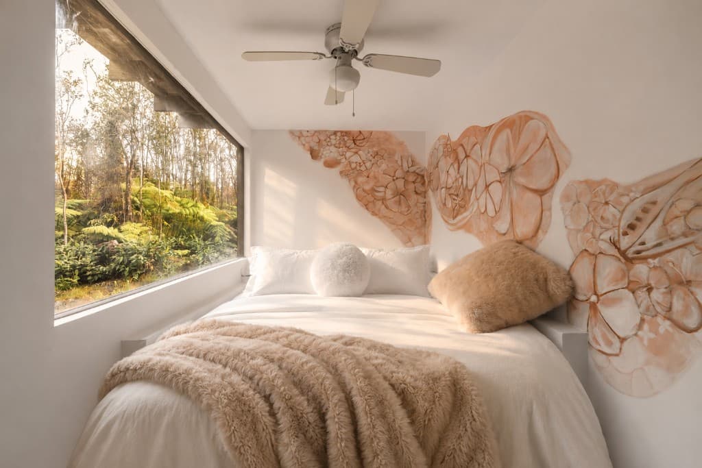 Bedroom with plumeria mural and forest view