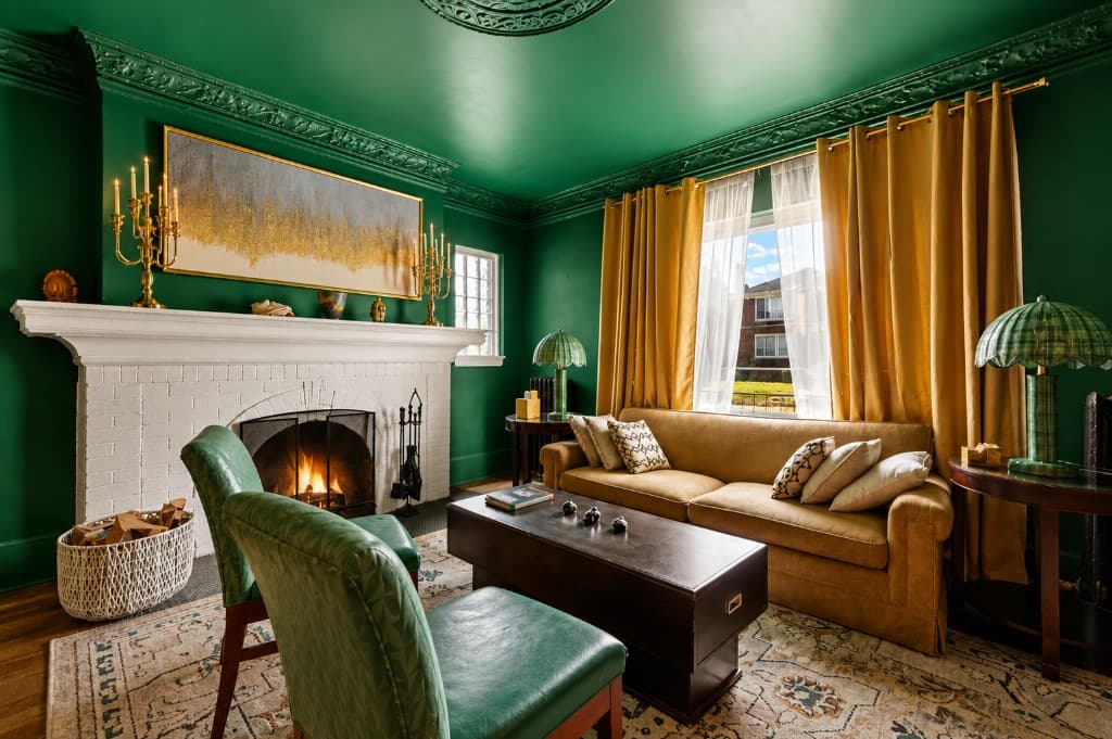 Emerald green living room with mustard sofa