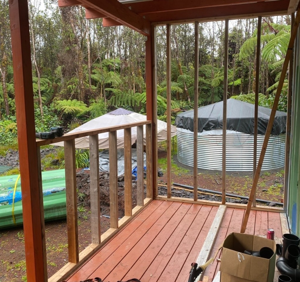 Lanai framing under construction, open to the forest